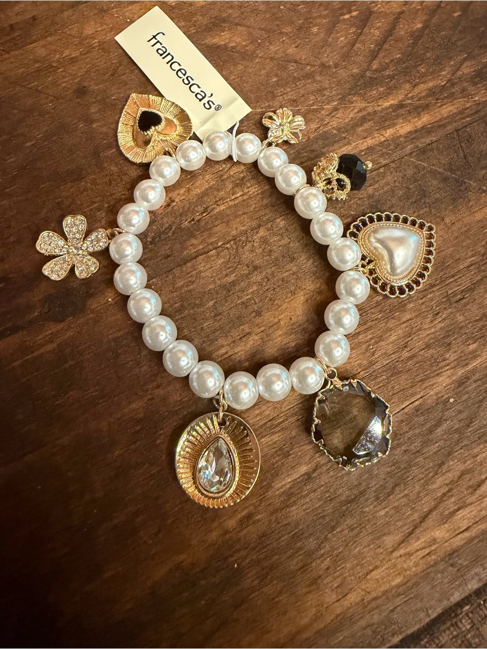 Francesca's Collections Pearl Stretch Bracelet with Gold Charms and Black Accent